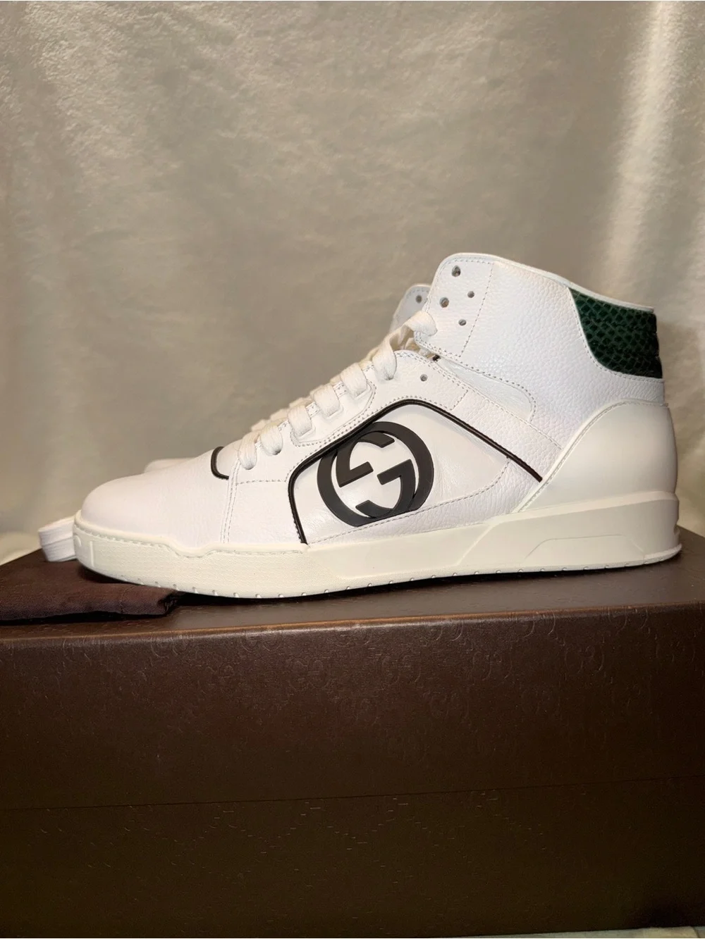 Gucci White Leather Low-Top Sneakers with Red Logo Sole.